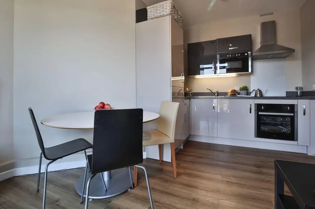 Table chairs apples kitchen counter oven kitchen at Library Lofts in Exeter Student Accommodation