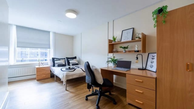 Bed desk chair and closet student room at Garth Heads in Newcastle Upon Tyne Student Accommodation