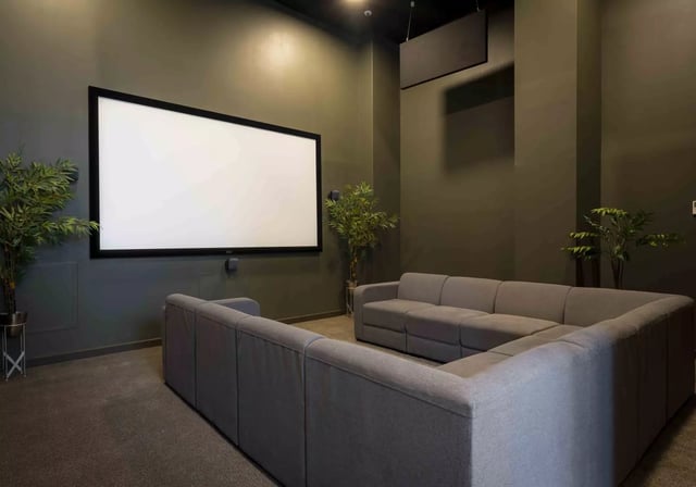 Large screen sofas plants movie room at iQ Astor House in Plymouth Student Accommodation
