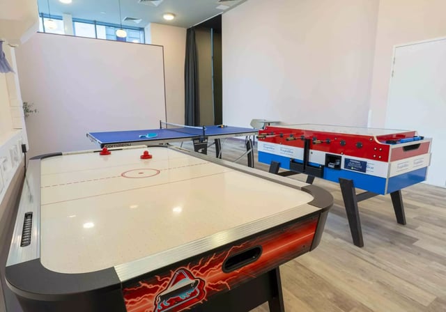 Air hockey table ping pong table foosball table game area at iQ Astor House in Plymouth Student Accommodation
