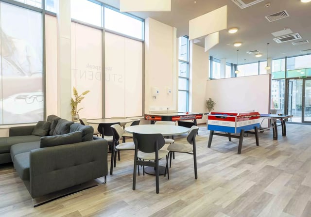 Sofa tables air hockey and foosball tables common area at iQ Astor House in Plymouth Student Accommodation