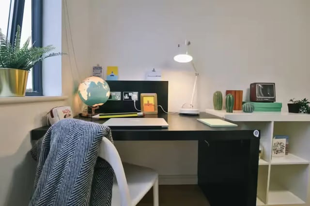 Desk with globe lamp and laptop study area at Chatham Lodge in Liverpool Student Accommodation