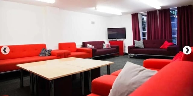 Sofa television table and chairs living room at Alliance House in London Student Accommodation