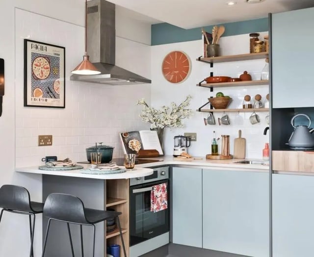 Stove oven counter chairs and shelving kitchen at Summit House in Cardiff Student Accommodation