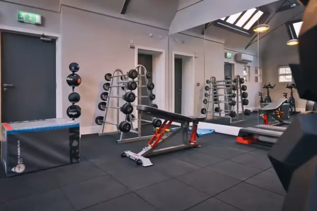 Dumbbells bench exercise bikes gym equipment gym at Maple House in Liverpool Student Accommodation