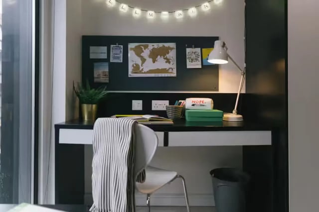 Desk with lamp bulletin board and chair study area at Maple House in Liverpool Student Accommodation