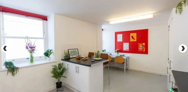 Kitchen with island and dining table kitchen at The Craft Building in London Student Accommodation