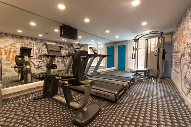 Treadmills exercise bikes weight machine gym area at Buccleuch Street in Edinburgh Student Accommodation