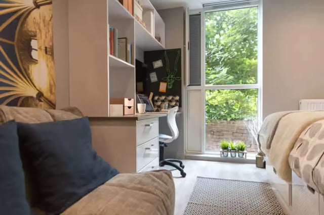 Sofa desk shelves window bed bedroom at Buccleuch Street in Edinburgh Student Accommodation
