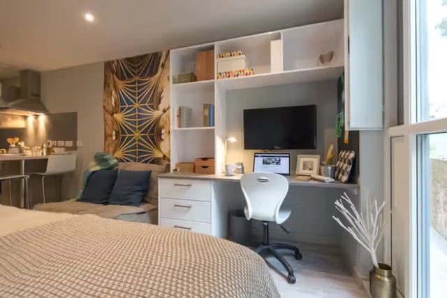 Bed desk chair television and sofa studio apartment at Buccleuch Street in Edinburgh Student Accommodation