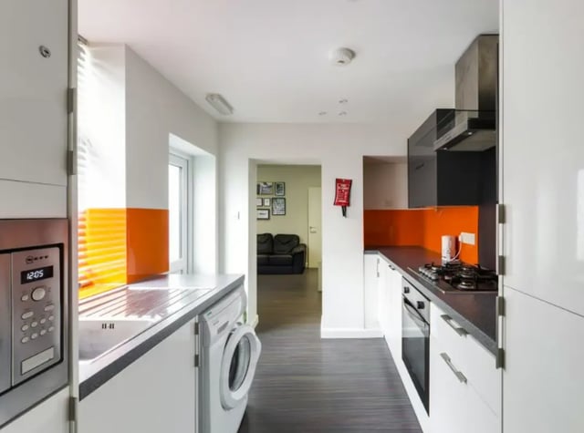 Modern kitchen with washing machine and oven kitchen at 26 Beresford Street in Stoke-On-Trent Student Accommodation