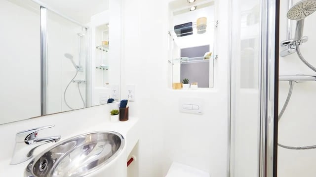Sink shower and toilet with shelf Bathroom at Burges House in Coventry Student Accommodation