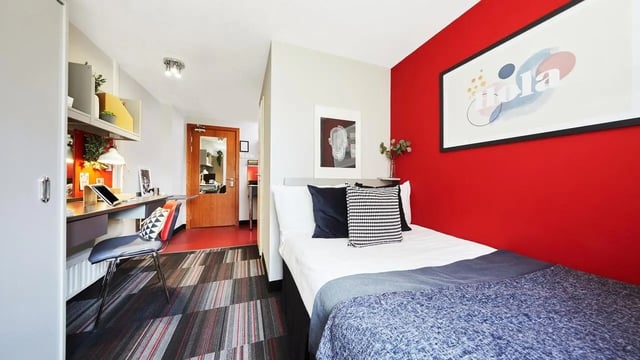 Bed desk chair and artwork bedroom living room at Burges House in Coventry Student Accommodation