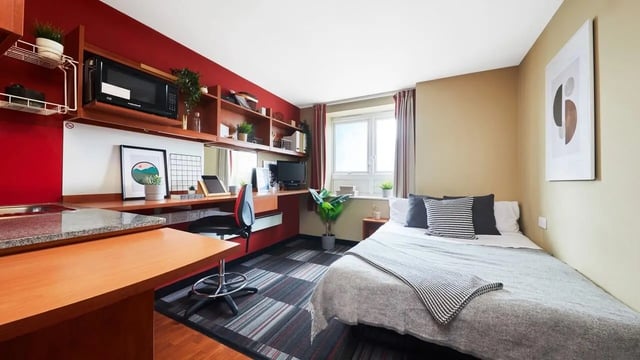 Bed desk microwave and kitchen studio apartment at Market Way in Coventry Student Accommodation