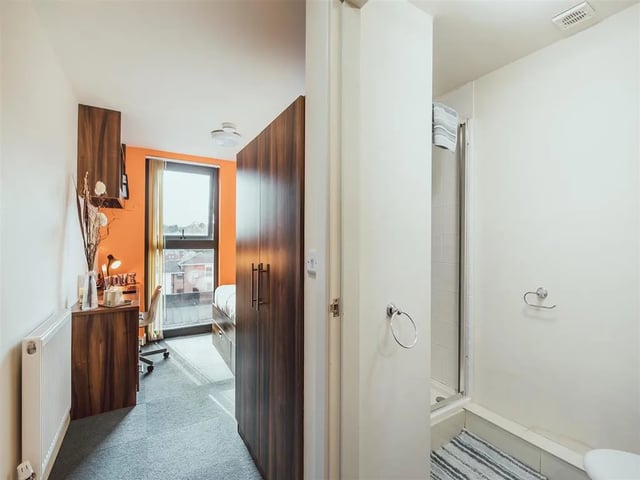 Desk bed wardrobe and shower cubicle bedroom bathroom at Lomax Halls in Stoke-On-Trent Student Accommodation