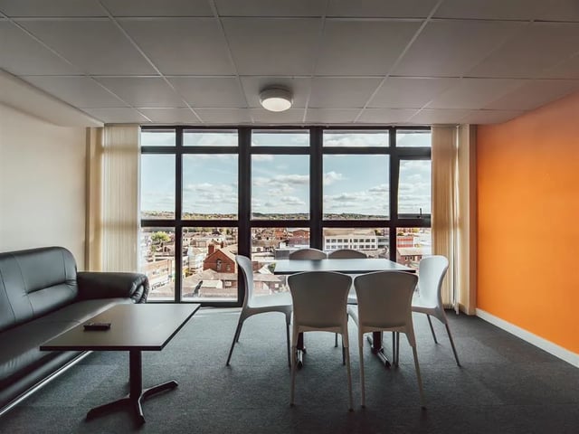 Black sofa table chairs dining area living room at Lomax Halls in Stoke-On-Trent Student Accommodation