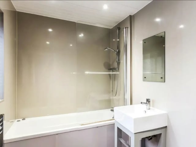 Modern bathroom with bathtub sink and shower at 28 Seaford Street in Stoke-On-Trent Student Accommodation