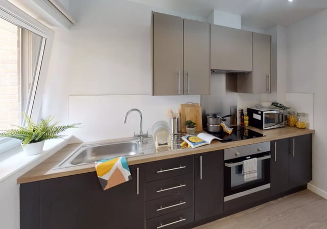 Modern student kitchen with sink oven microwave kitchen at iQ Fenton House in Sheffield Student Accommodation
