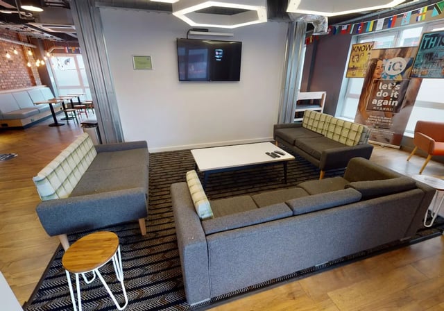 Sofas television white table lounge area at iQ Fenton House in Sheffield Student Accommodation