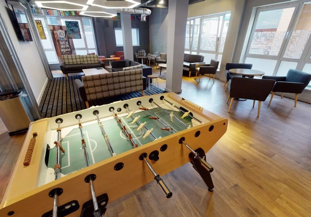 Foosball table sofas chairs tables common area at iQ Fenton House in Sheffield Student Accommodation