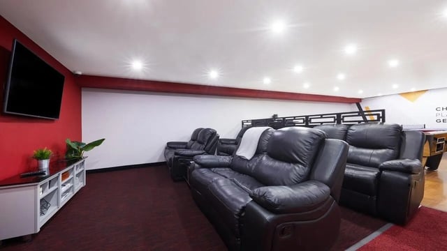 Leather recliners TV and a pool table living room at Pillar Box in Coventry Student Accommodation