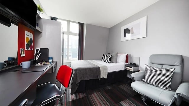 Desk bed chair with cushions bedroom study area at Pillar Box in Coventry Student Accommodation
