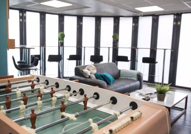 Foosball table couch and bar stools playing area at iQ Fiveways House in Wolverhampton Student Accommodation
