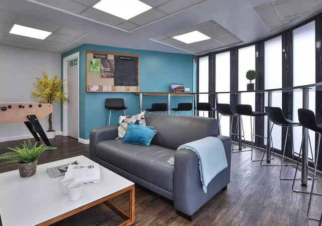 Sofa foosball table and bar stools common area at iQ Fiveways House in Wolverhampton Student Accommodation