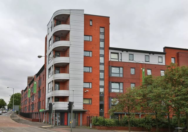Red brick building with balconies exterior at iQ Fiveways House in Wolverhampton Student Accommodation