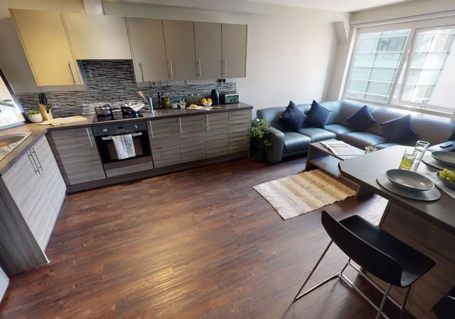 Kitchen sofa table and chair area at iQ Great Newton House in Liverpool Student Accommodation
