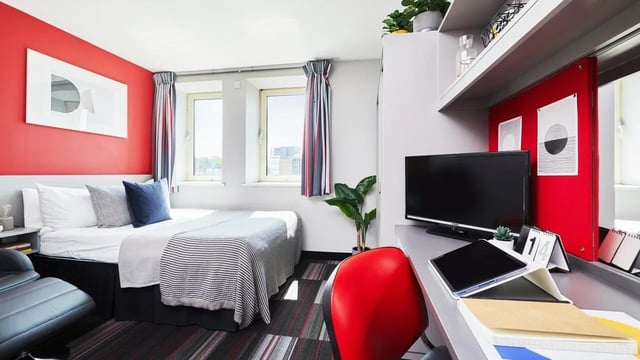 Bed desk with TV and chair bedroom at Corporation Village in Coventry Student Accommodation