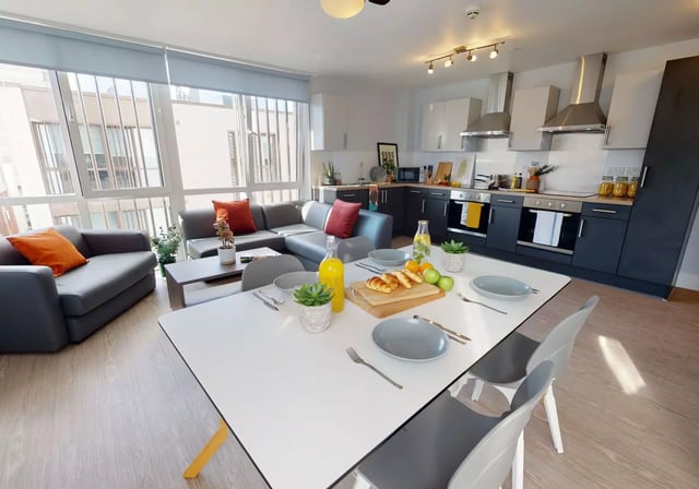 Sofa table kitchen appliances dining setting living room kitchen at iQ Magenta House in London Student Accommodation