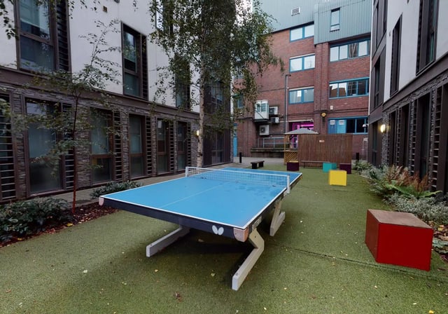 Ping pong table on artificial turf courtyard exterior at iQ Magenta House in London Student Accommodation