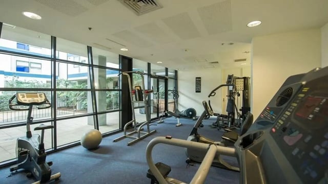 Exercise machines and fitness ball gym area at Student Living - 800 Swanston in Melbourne Student Accommodation