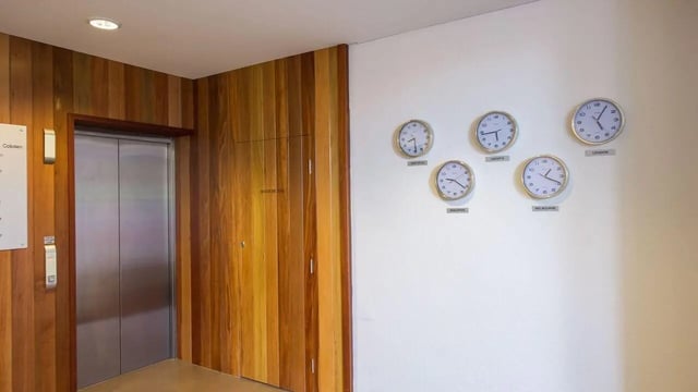 Lift and world clocks lobby at Student Living on Cobden in Melbourne Student Accommodation