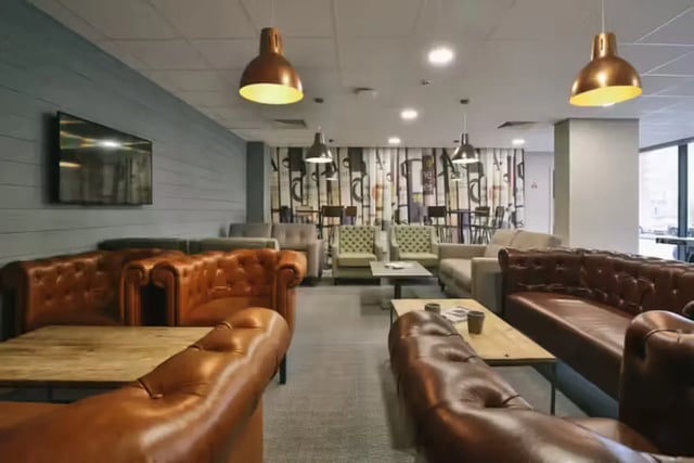 Leather sofas and armchair seating common area at Oldgate House in Huddersfield Student Accommodation