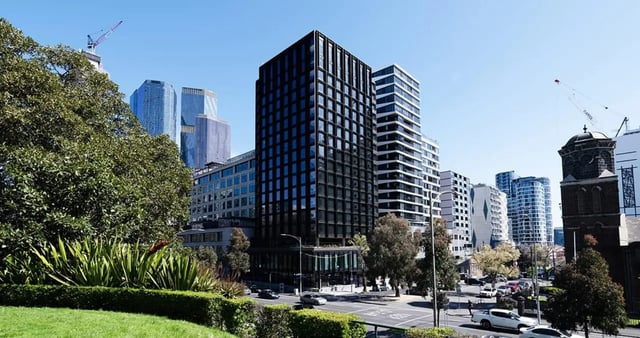 Modern black building city skyline greenery exterior at Iglu Flagstaff Gardens in Melbourne Student Accommodation