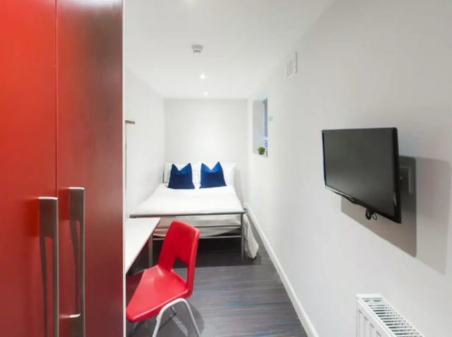 Bed desk red chair TV bedroom at 210 Cauldon Road in Stoke-On-Trent Student Accommodation