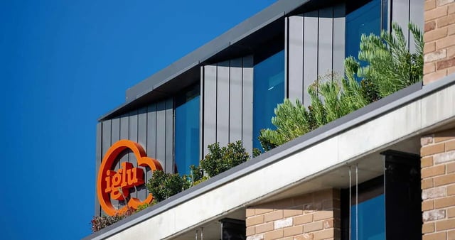 Orange Iglu logo green plants exterior at Iglu Summer Hill in Sydney Student Accommodation