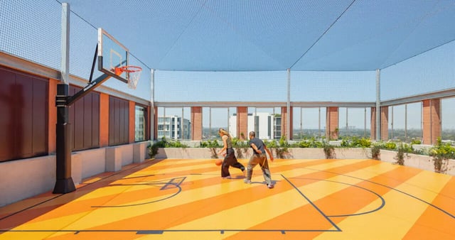 Basketball court with two people playing playing area at Iglu Mascot in Sydney Student Accommodation