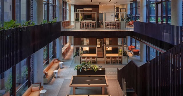 Pool table seating areas and study booths lounge at Iglu Mascot in Sydney Student Accommodation