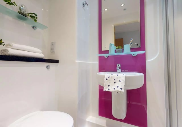 Sink shelves and towels bathroom at iQ Penworks House in Birmingham Student Accommodation