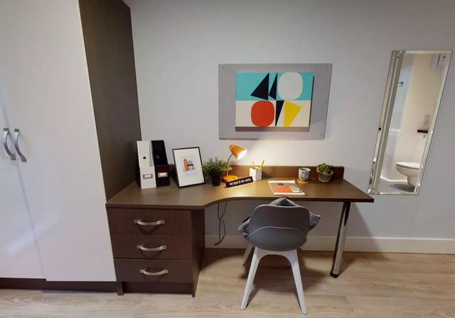 Desk binders art lamp chair and mirror bedroom at iQ Penworks House in Birmingham Student Accommodation