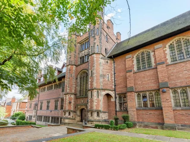 Historic brick building with large arched windows exterior at The Priory in Leeds Student Accommodation
