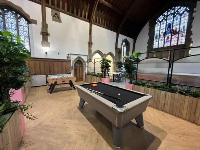 Pool table foosball table plants living room at The Priory in Leeds Student Accommodation