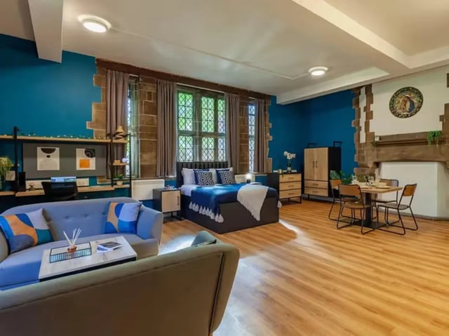 Studio apartment with sofa bed and dining area at The Priory in Leeds Student Accommodation