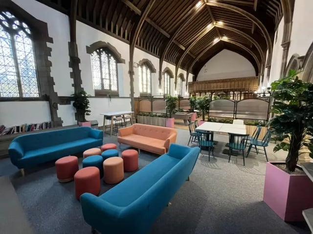 Sofas stools tables and chairs communal area at The Priory in Leeds Student Accommodation