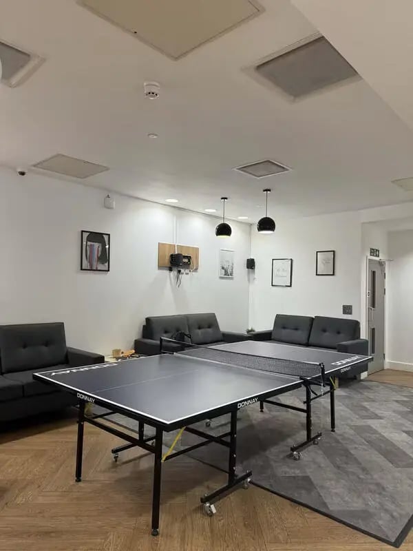 Ping pong table with couches common area at Concept Place in Leeds Student Accommodation