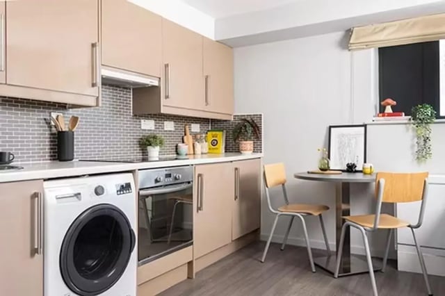 Washing machine oven table chairs kitchen at Sky Plaza in Leeds Student Accommodation