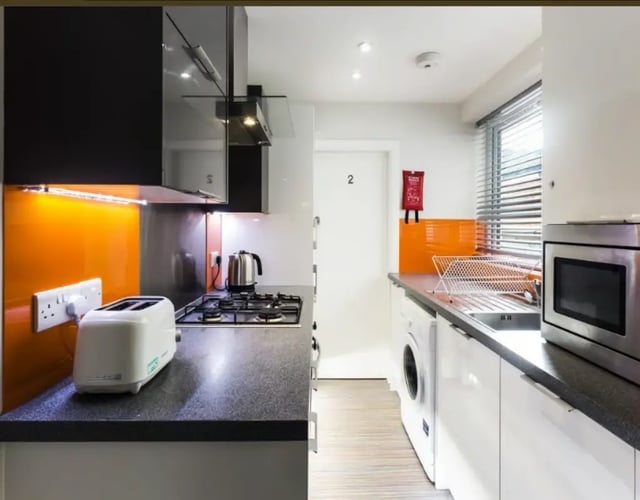 Toaster kettle hob dishwasher and microwave kitchen at 17 Carlton Road in Stoke-On-Trent Student Accommodation